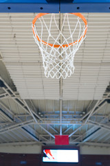 basketball hoop and net, in a gym