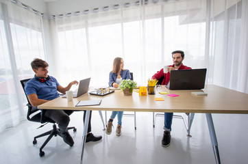 Creative business people working in start up office,modern creative and design worker concept, Group Of Asian and Multi-ethnic Business people with casual suit talking and brainstorming