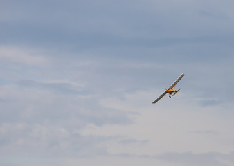 Army liaison aircraft flying in the sky