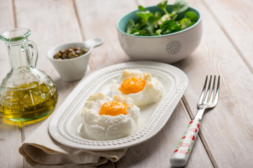 owen eggs eith salad capers and olive oil