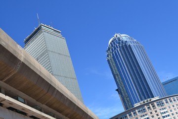 Low angle image of skyscrapers against a blue sky in Boston 