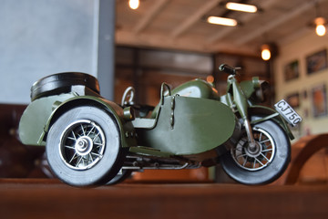  Car models are antiques, and these days are for display. But whenever you look Made him think of olden days as a child