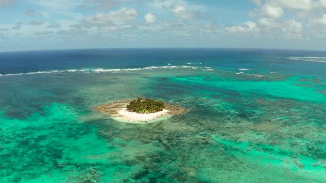 Tropical landscape: Daco island with beautiful beach, palm trees by turquoise water view from above. Siargao, Philippines. Summer and travel vacation concept