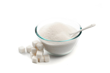 Sugar in glass bowl isolated on white background