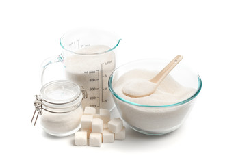 .glass beaker and bowl with sugar isolated on white background