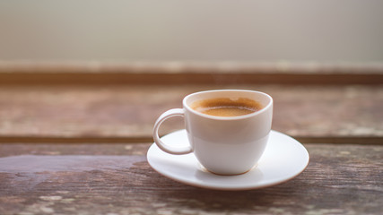 cup of coffee on wooden table