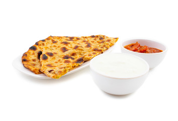 Indian Traditional Breakfast Dish Aloo Paratha is a Potato Stuffed Flatbread Served With Fresh Curd And Pickle 
