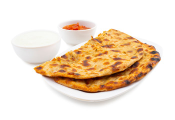 Indian Traditional Breakfast Dish Aloo Paratha is a Potato Stuffed Flatbread Served With Fresh Curd And Pickle 