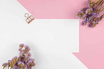 Top view of paper note and purple statice flower
