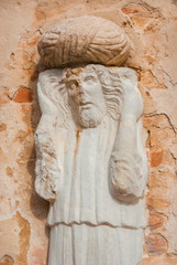 Moorish merchant with turban ancient medieval statue located in Campo dei Mori (Moors Square) in the historic center of Venice (13th century, author unknown)
