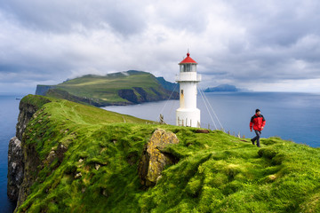 Fototapeta na wymiar Lighthouse on Mykinesholm, Mykines Island, Denmark Faroe Islands