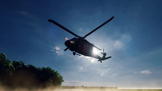 A Blackhawk military helicopter lands on a dusty road on a clear day in a deserted area.