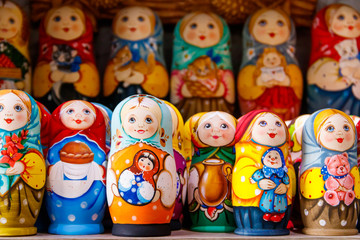 Fototapeta na wymiar Traditional souvenirs from Russia - colorful nesting dolls, also known as matryoshka, babushka, stacking dolls, or Russian dolls