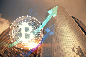 Double exposure of crypto currency theme hologram drawing and city veiw background. Concept of blockchain and bitcoin.