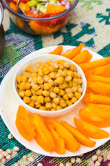Homemade cooked chickpea bowl with vegetables (tomatoes).