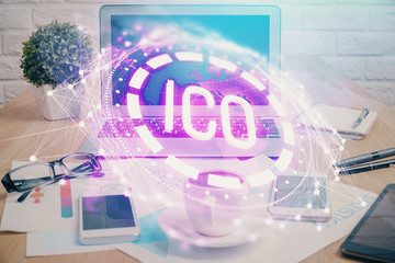 Double exposure of blockchain and crypto economy theme hologram and table with computer background....