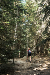 Obraz premium woman hiking in the national park d´aiguestortes in the Pyrenees in Spain