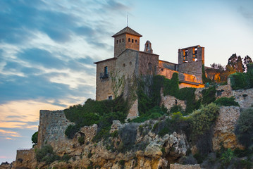 Fototapeta premium Castle of Tamarit seen from the beach on the sunset, Tarragona province, Catalonia, Spain.