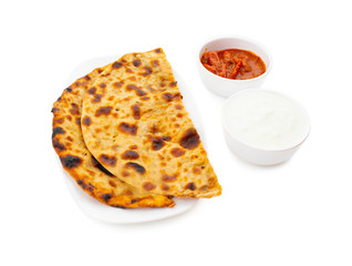 Indian Traditional Breakfast Dish Aloo Paratha is a Potato Stuffed Flatbread Served With Fresh Curd And Pickle 