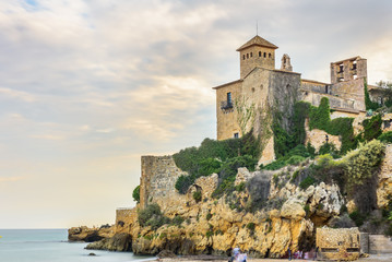Fototapeta na wymiar Tamarit, Spain - 2019 august 31 : A view of the ancient castle from the beach. Tarragona Spain.