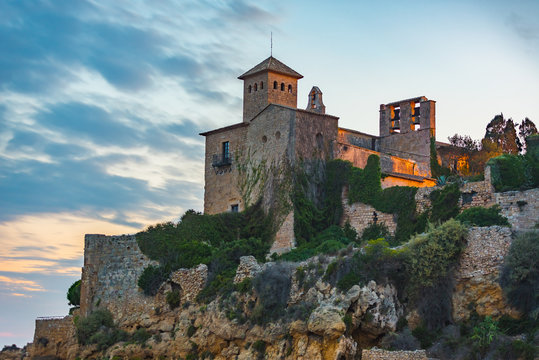 Castle of Tamarit seen from the beach on the sunset, Tarragona province, Catalonia, Spain.