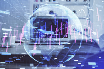 Financial graph colorful drawing and table with computer on background. Multi exposure. Concept of international markets.