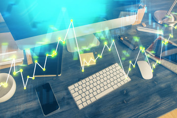 Multi exposure of chart and financial info and work space with computer background. Concept of...