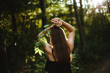 Woman/girl in the wood sunset