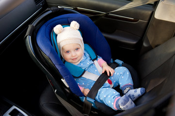 baby sitting in a car seat, top view
