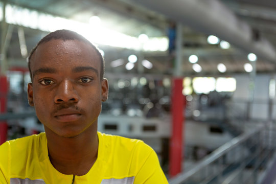 Disabled African American male athletic looking at camera in fitness center - Powered by Adobe