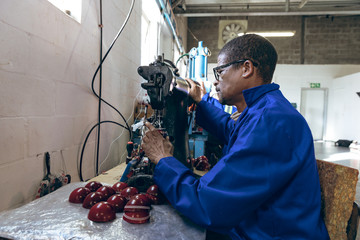 Middle aged man working in a sports equipment factory
