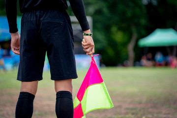 Flag soccer in hand of assistant referee soccer football 