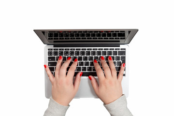 Fototapeta na wymiar Female hands with red nails working on laptop isolated on white background. Mockup for business concept or office desktop.