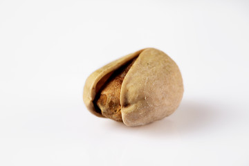 salted pistachio nuts isolated on white background. close-up