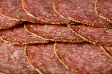 delicious sliced salami sausage . top view