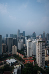 Fototapeta premium Aerial view of Kuala Lumpur city skyline during cloudy day, Malaysia