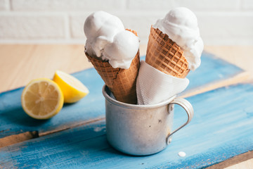 studio shot of tasty lemon ice cream in cone