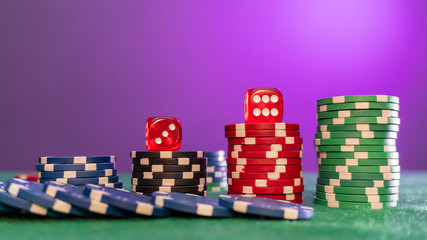 poker chips, dice on table close up