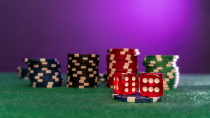 poker chips, dice on table close up
