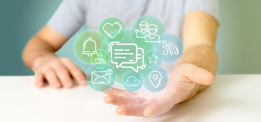Businessman holding a cloud of social media network icon