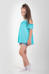 Thoughtful little girl six years old daughter look away on copy space thinking isolated on grey beige background, funny kid pout lips hold finger near mouth conceived some kind of prank, concept image