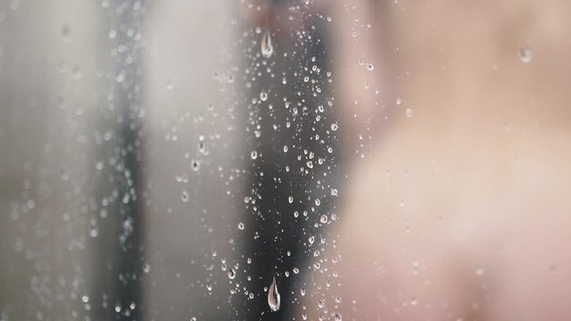 young woman taking a shower. beautiful young girl washing and enjoy herself under a shower