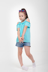 Thoughtful little girl six years old daughter look away on copy space thinking isolated on grey beige background, funny kid pout lips hold finger near mouth conceived some kind of prank, concept image