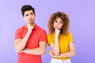 Portrait of thoughtful caucasian people man and woman in basic clothing thinking together with brooding look