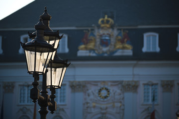 Historic street lamp with townhall Bonn in background