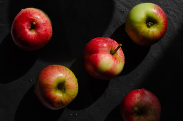 red apples on black background