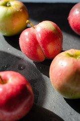 red apples on black background