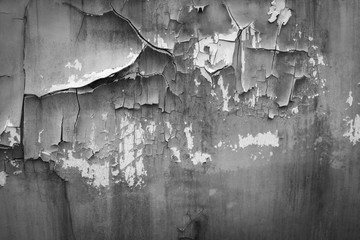 black and white Detail of an old metal wall, rust and cracked paint