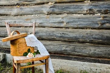 Retro-style. Summer in the country. Birch bark box with delicate ruffles. White rose on a vintage...