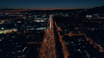 Night aerial shot of busy city traffic life